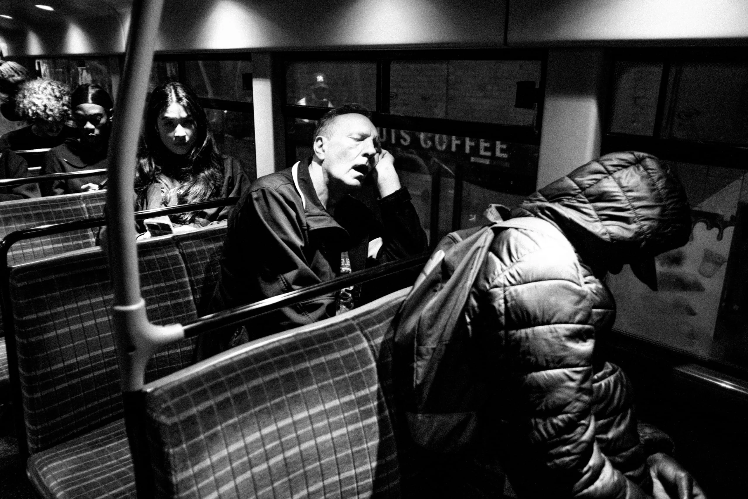 A man sleeps on the N55 bus home