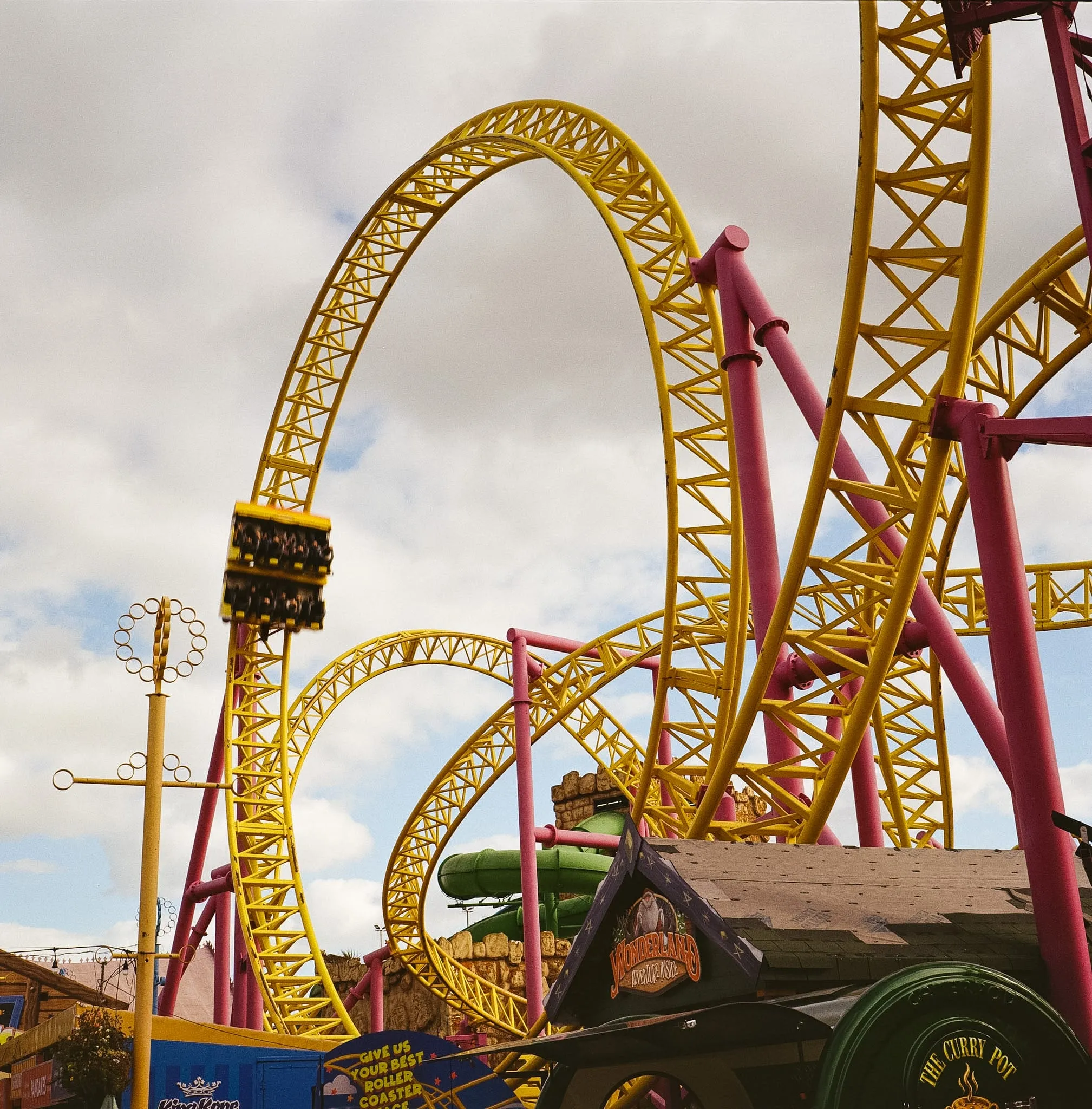 People enjoy a looping coaster in Adventure Island