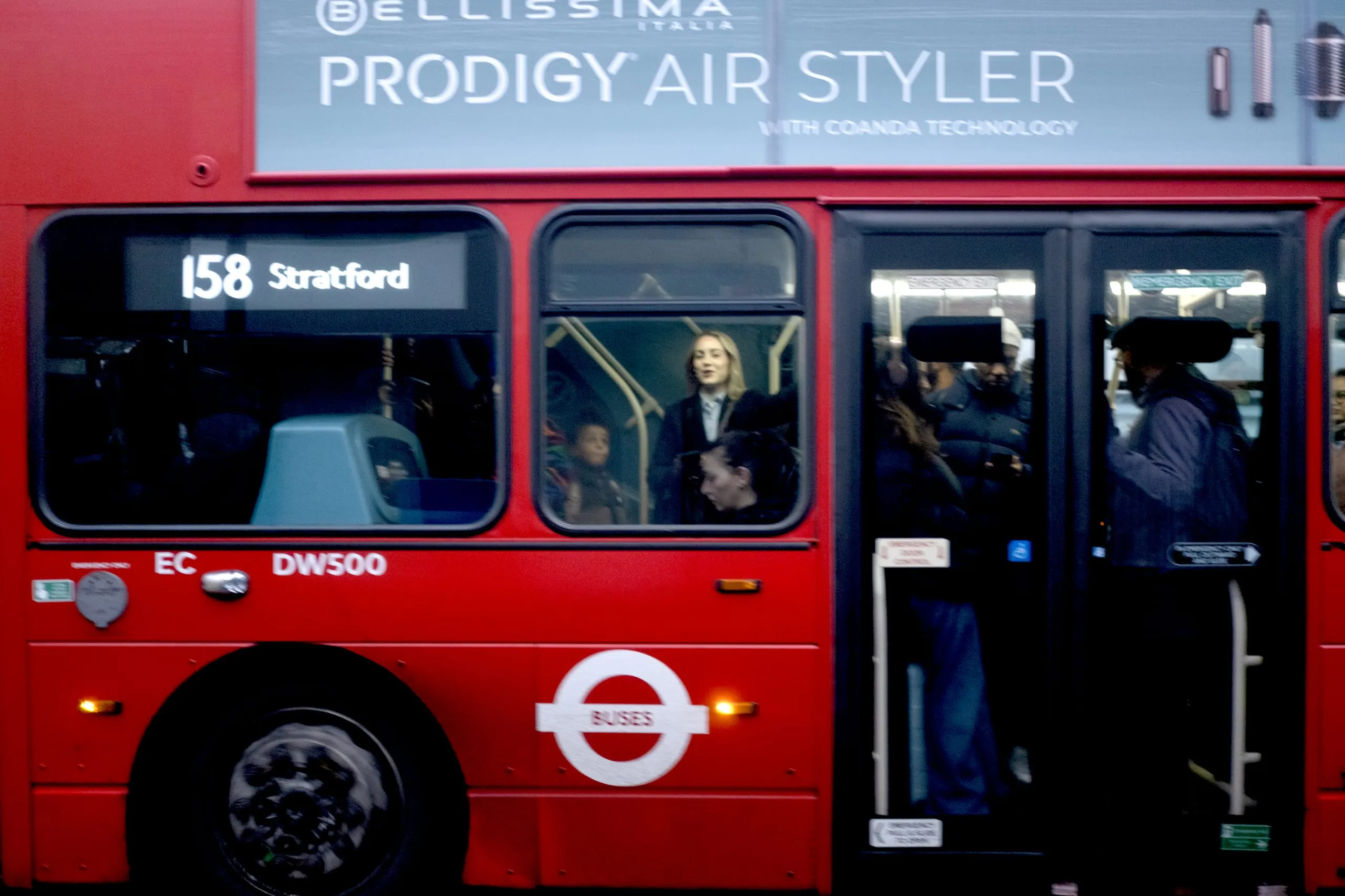 Woman heads to work on the 158 bus, Leyton
