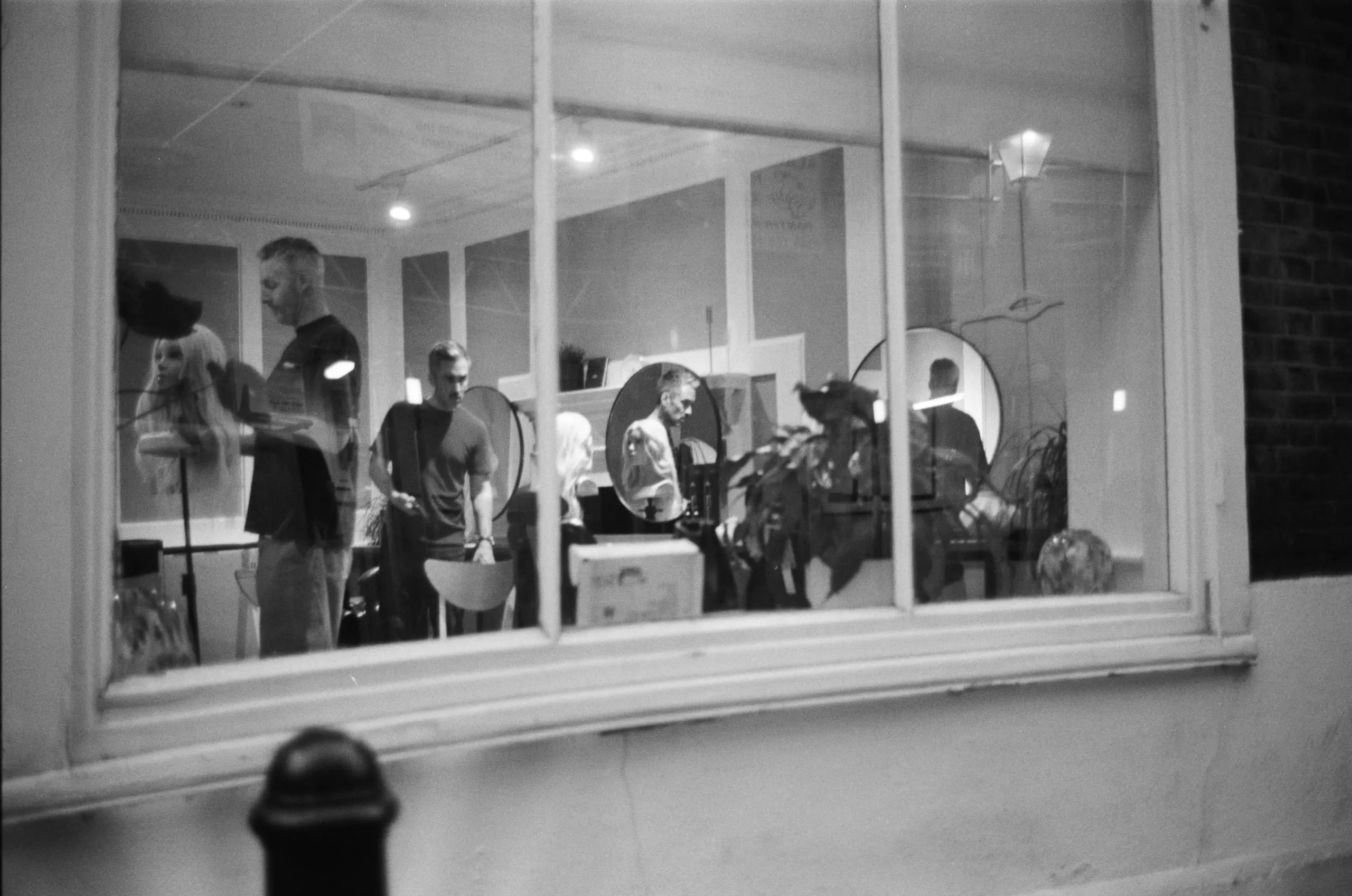 Two hair stylists in their studio and their mannequins, Spitalfields