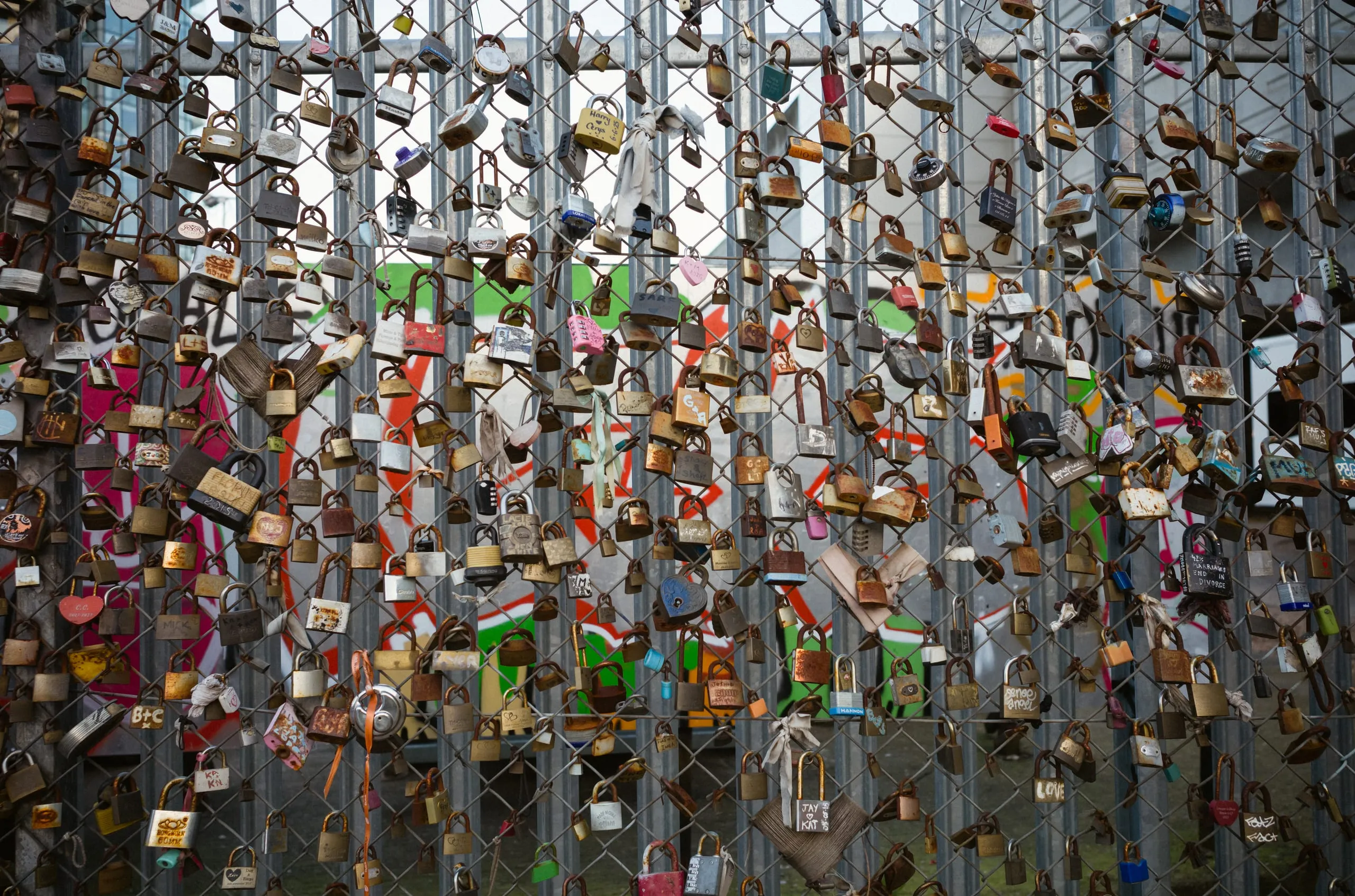 Padlocks chained to a fence