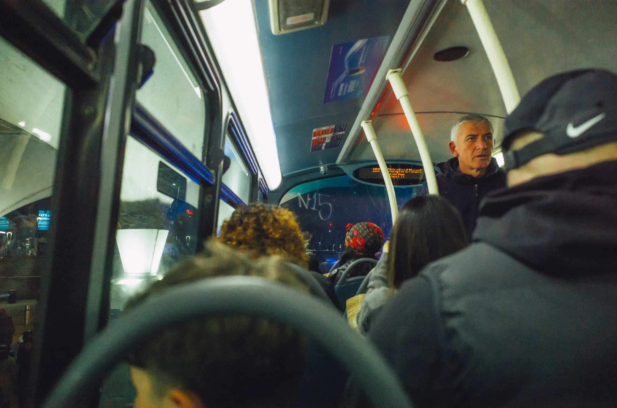 Passengers crowd the lower deck of an N15 night bus