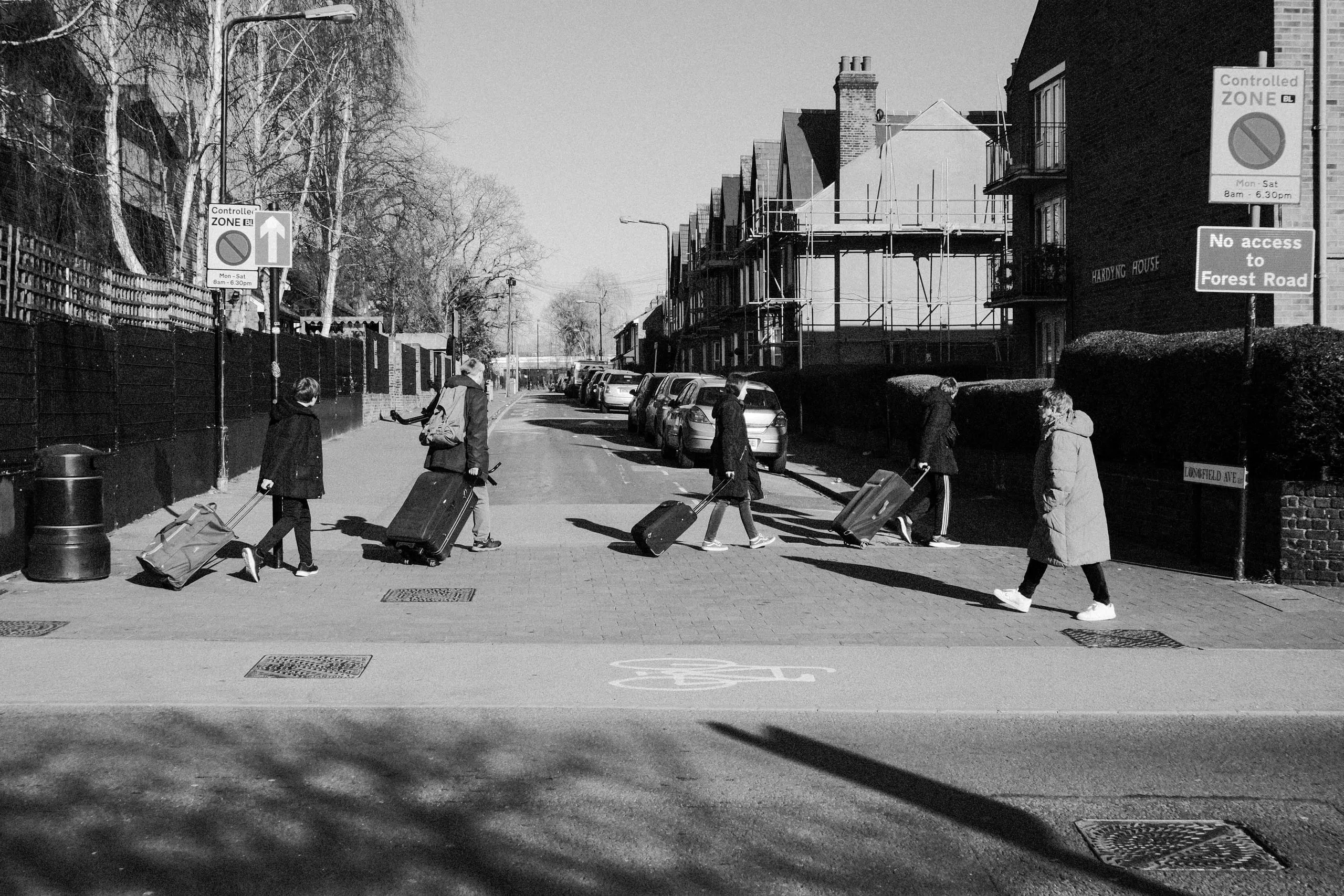 A family crosses the street, Walthamstow