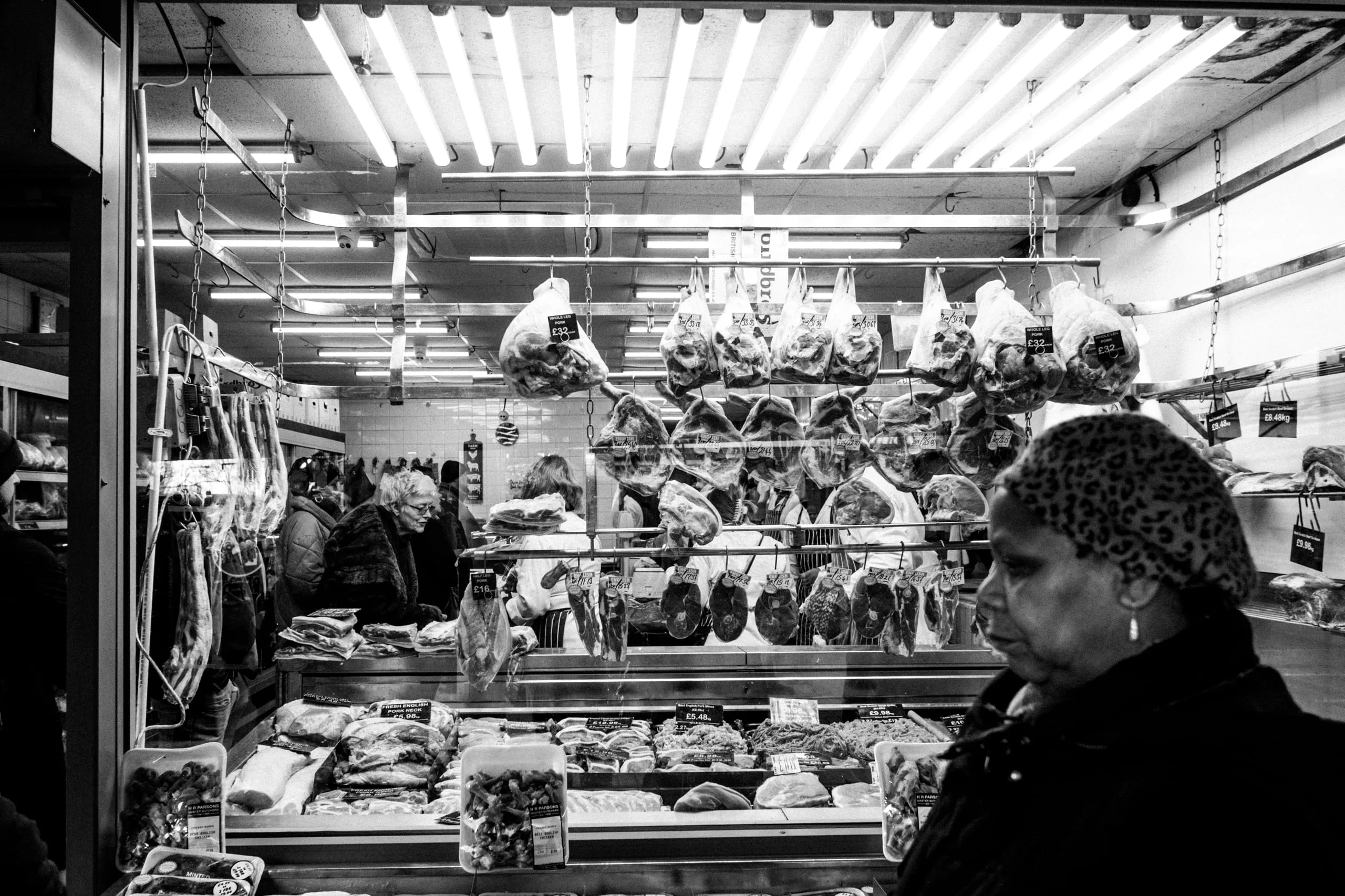 Women shop for meat at H.R. Parsons, Walthamstow