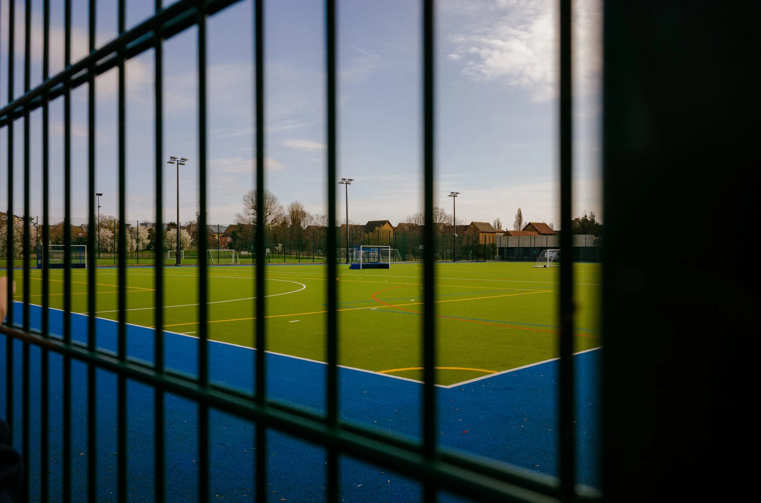 View of a futsal court from outside a fence