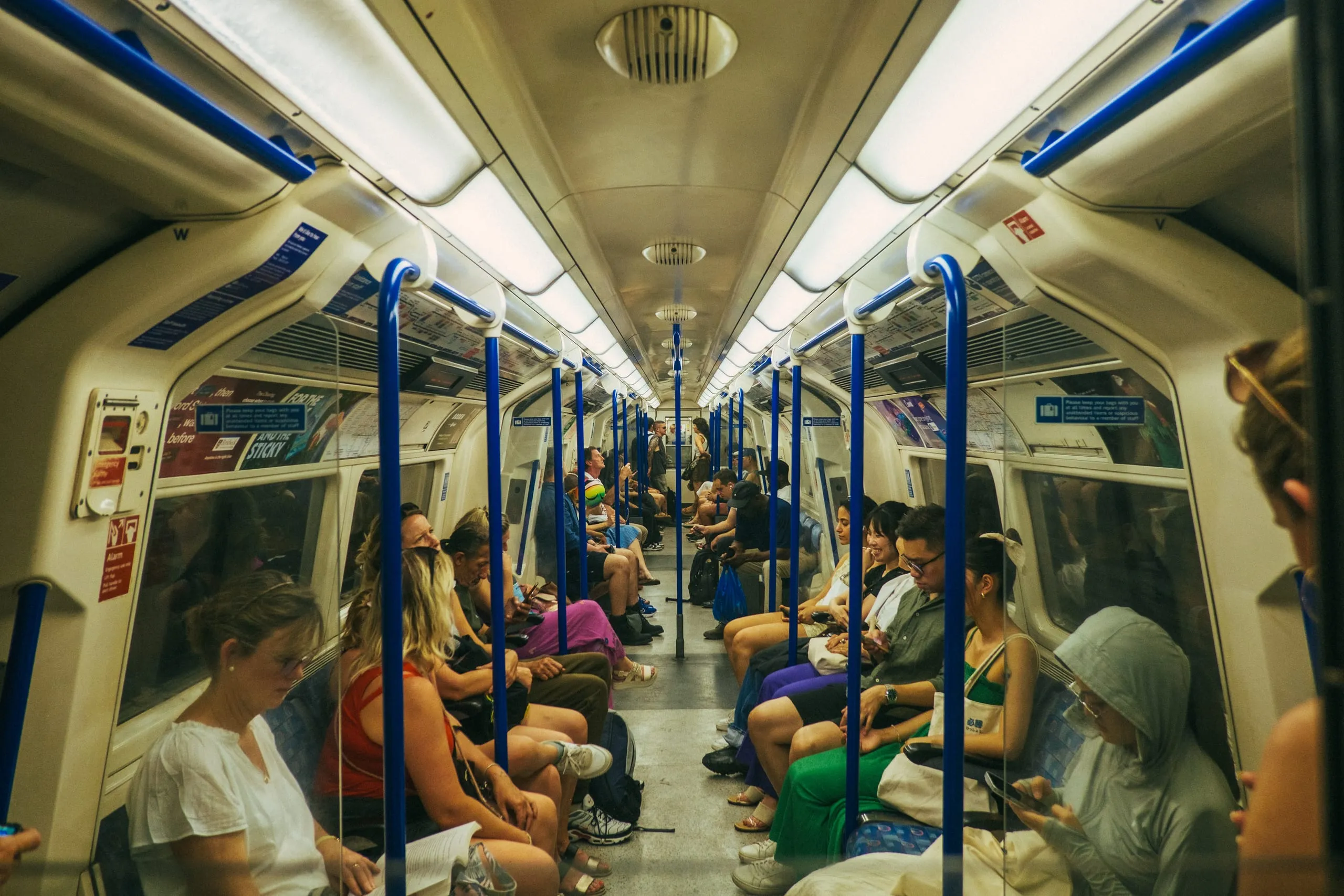 Moi and his friend exchange stairs at the end of a Victoria Line Carriage, London