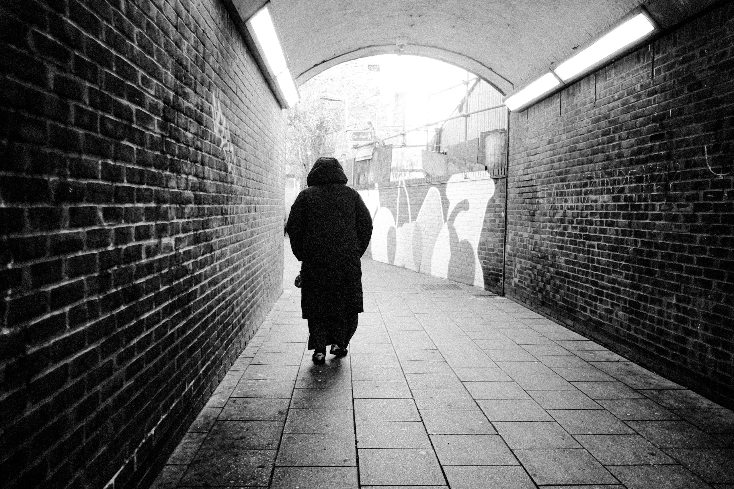 Woman walks away, Walthamstow