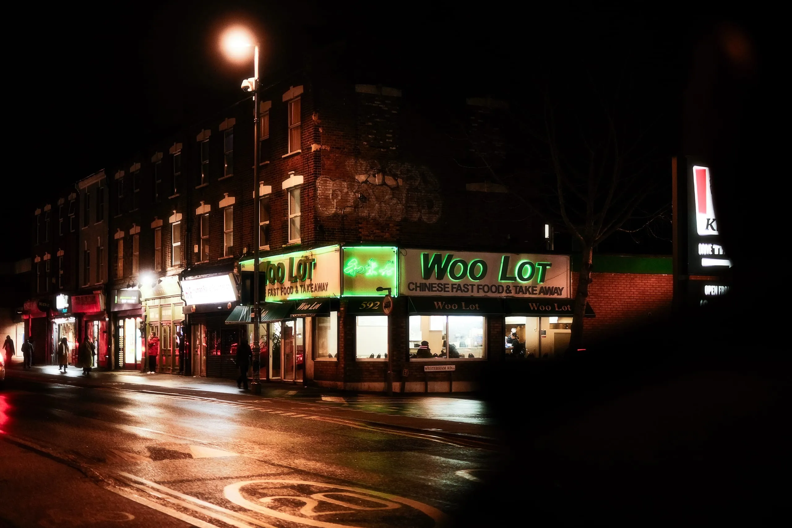 The neon signs of Woo Lot chinese restaurant in Lea Bridge Road
