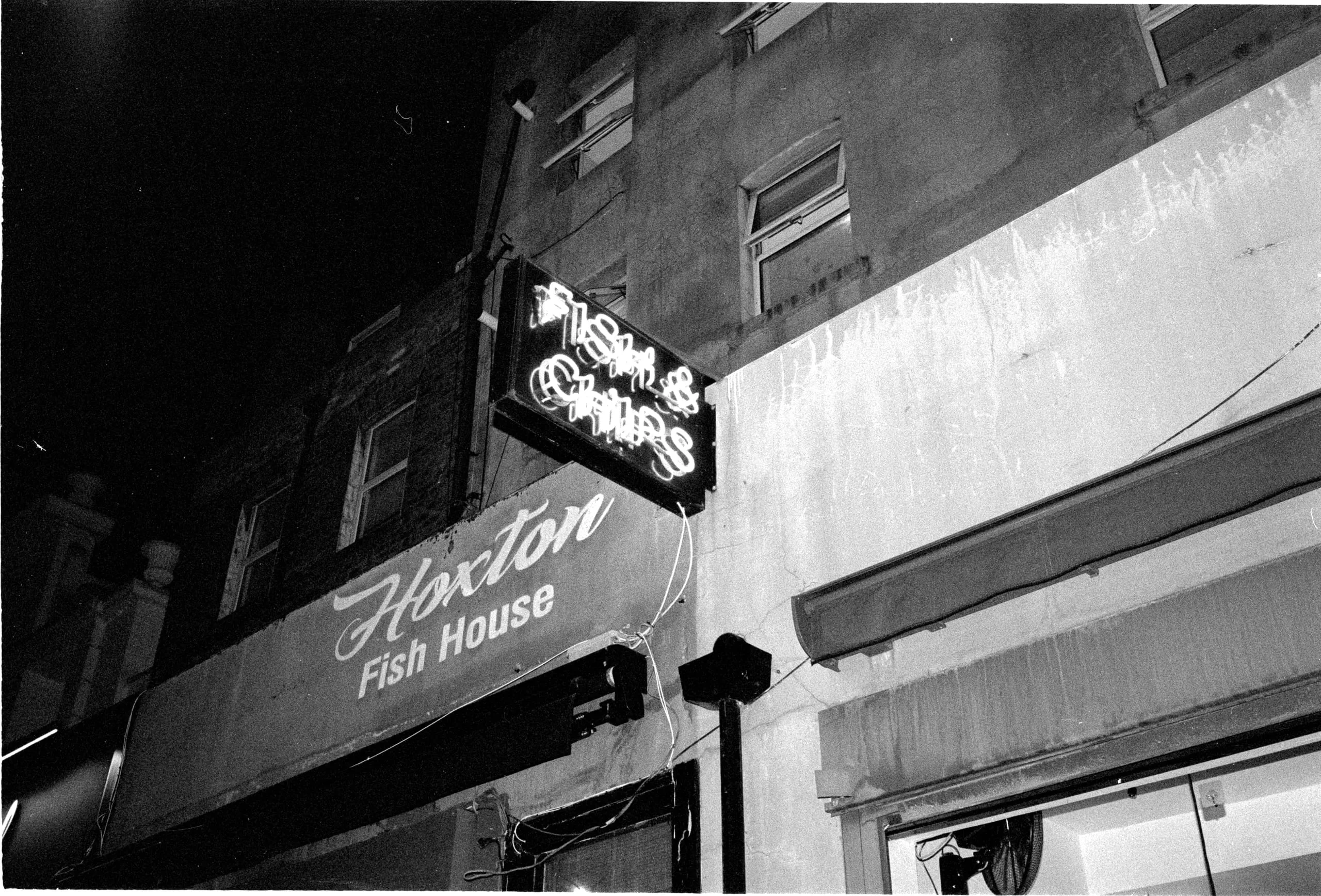 Neon sign of the Hoxton Fish House fish and chip shop at night, Hoxton