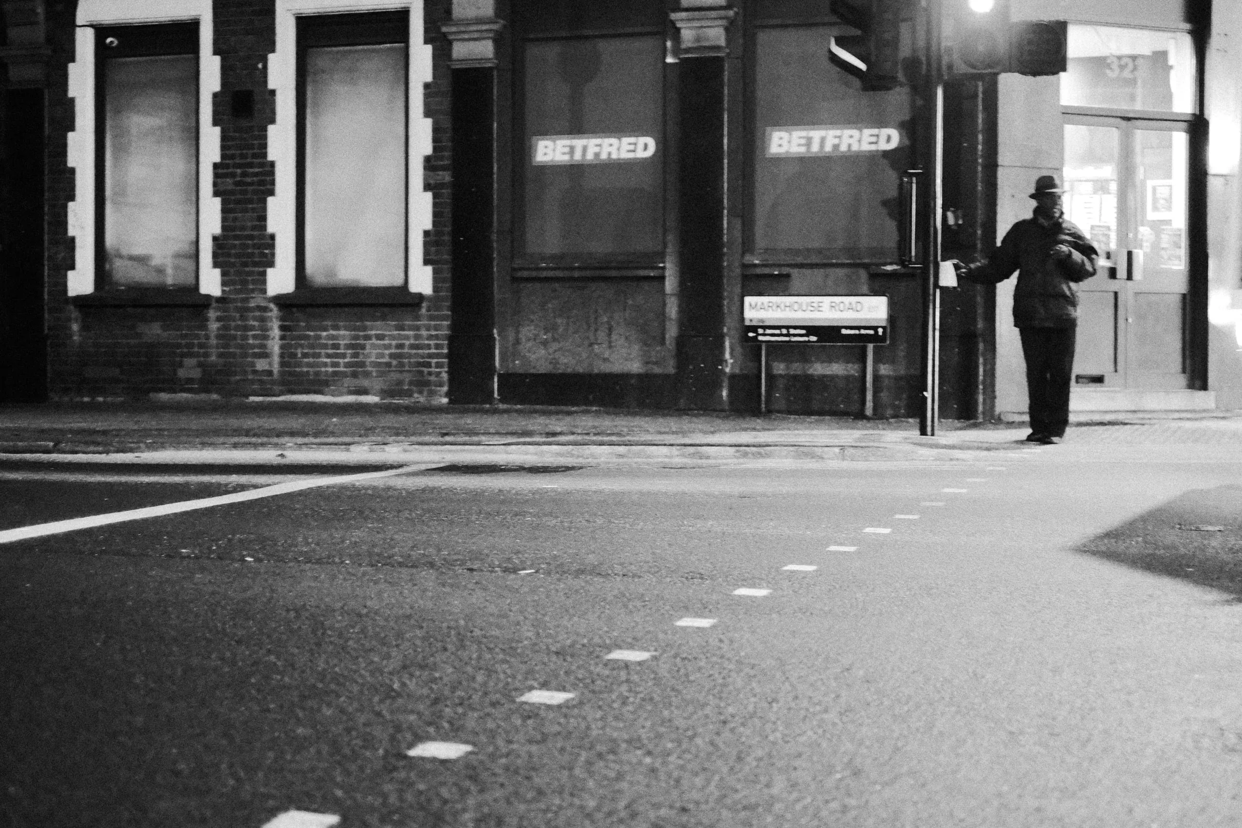 A man waits for green light, Lea Bridge Road