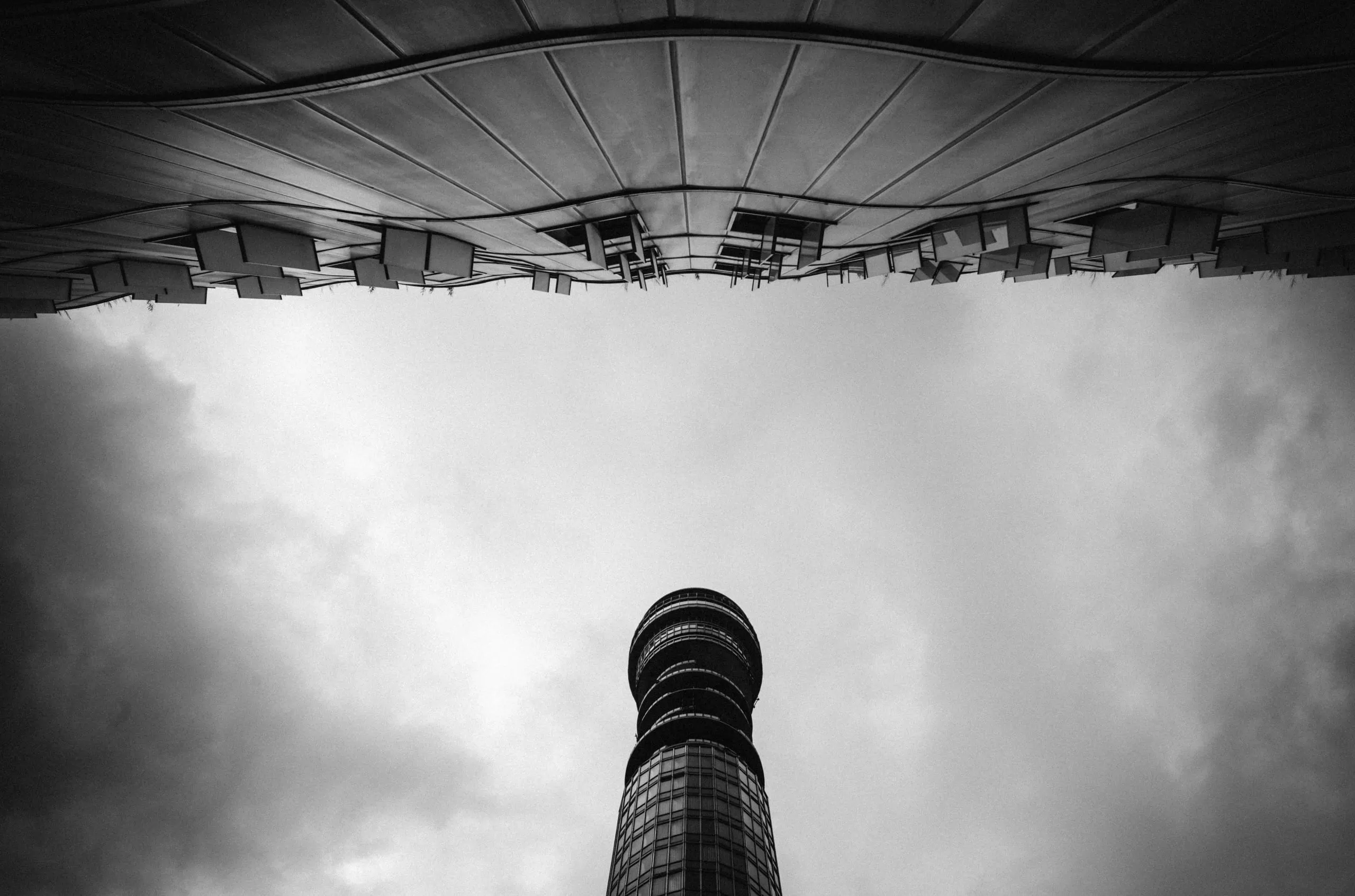 The BT tower against a modernist building