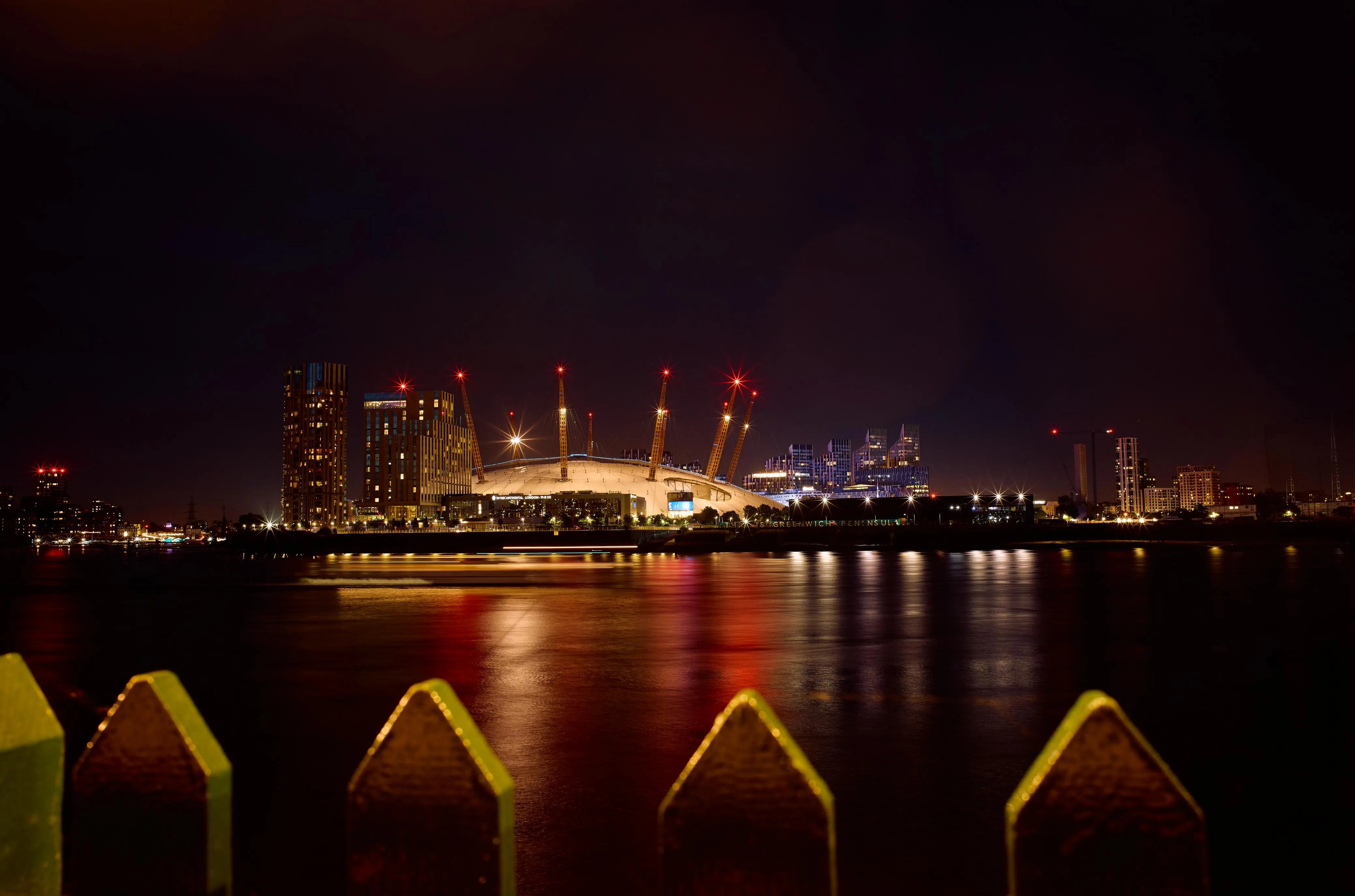 A boat sails by the Milenium Dome, London