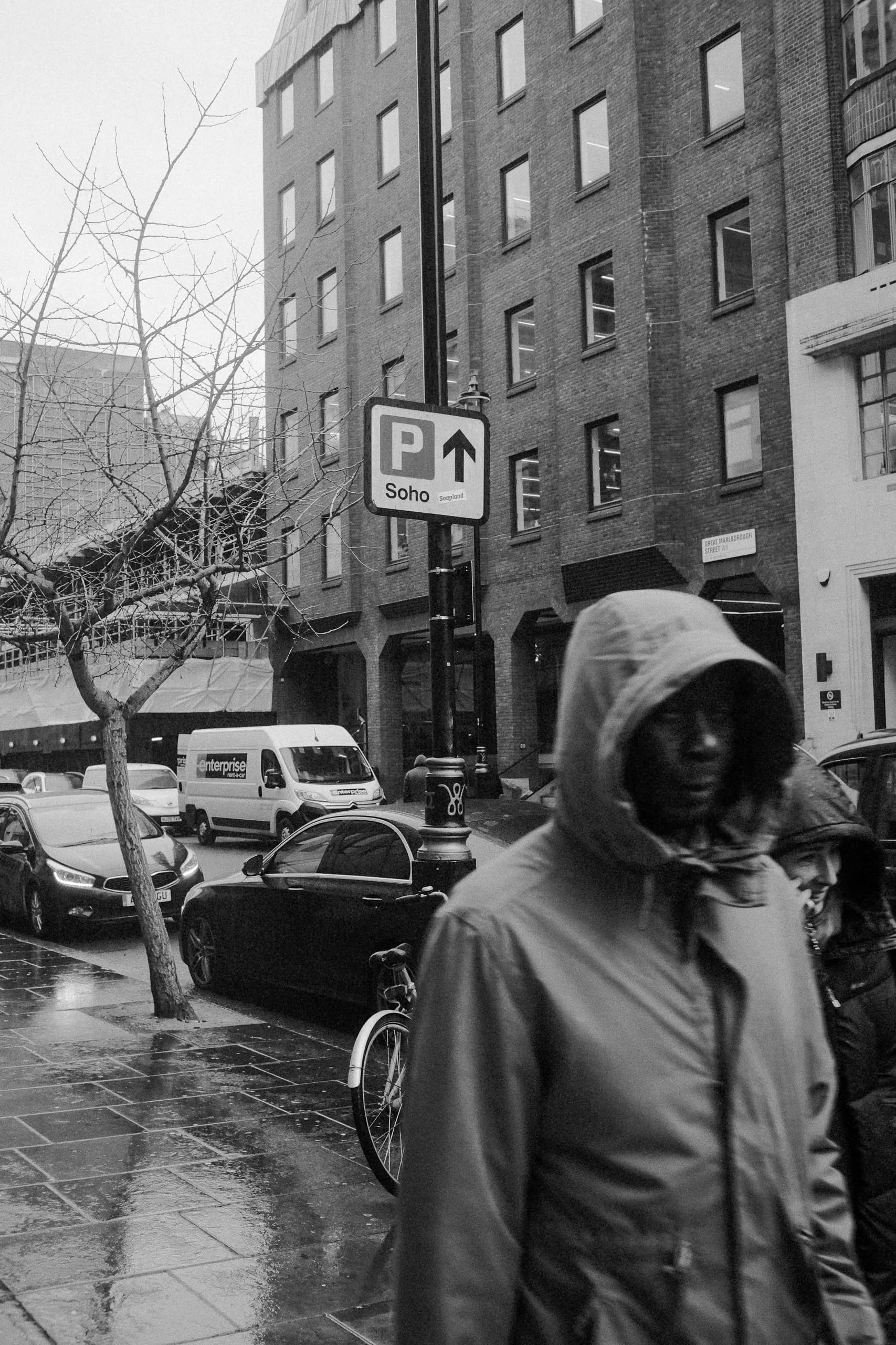 A man walks by the Photographer's Gallery, Soho