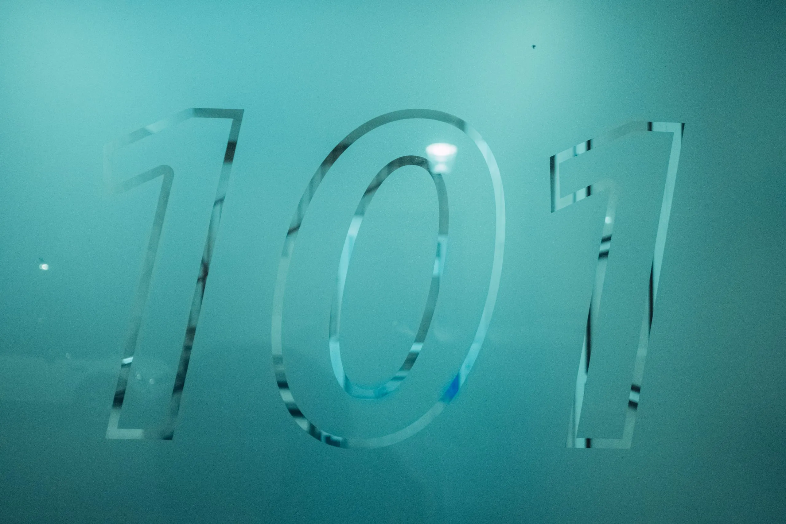 The numbers 101 etched into a pane of glass